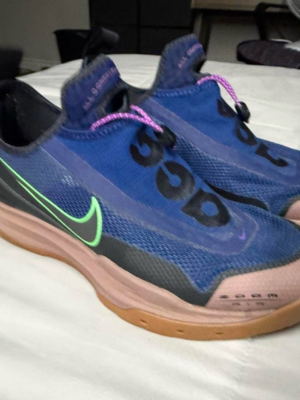 Nike Men's Blue Slip-On Sneakers with Green Swoosh and Pink Accents